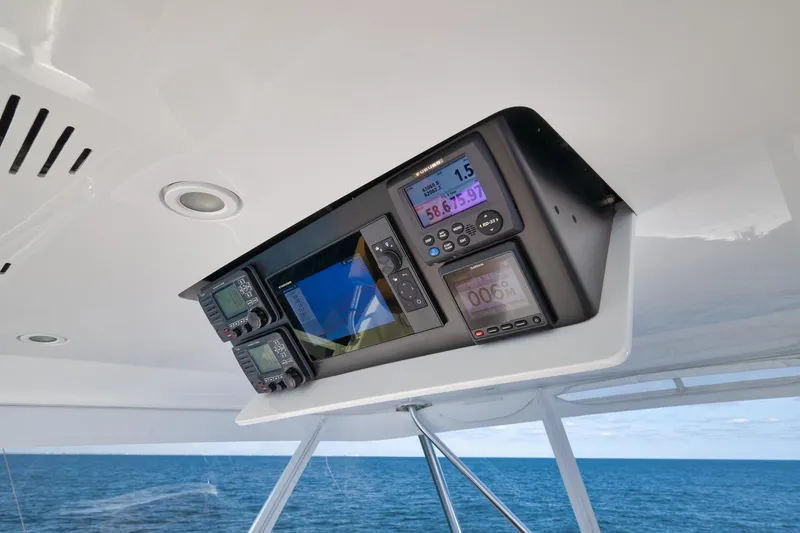 Slide: The Image of Control panel of a 2002 Weaver 60 Convertible boat with ocean view. - 28