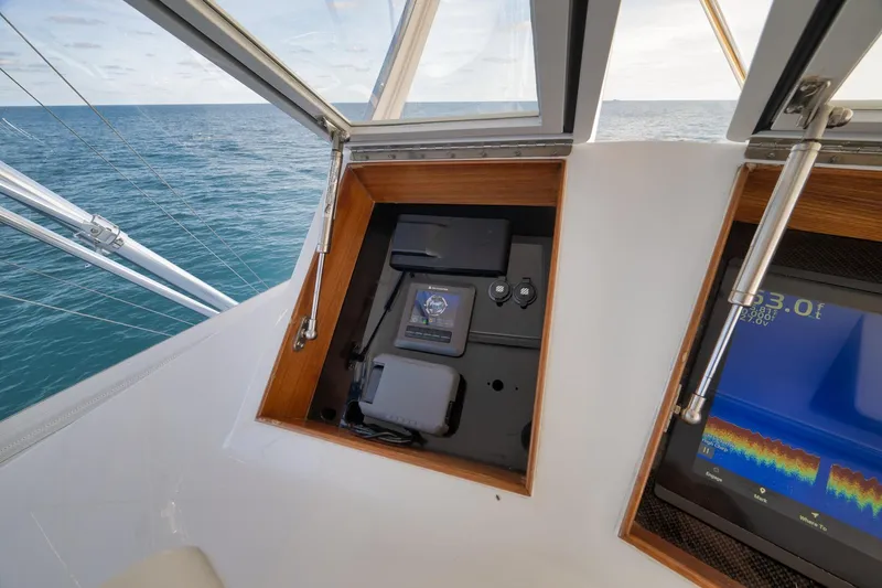 Slide: The Image of Control panel of a 2002 Weaver 60 Convertible yacht with ocean view. - 31