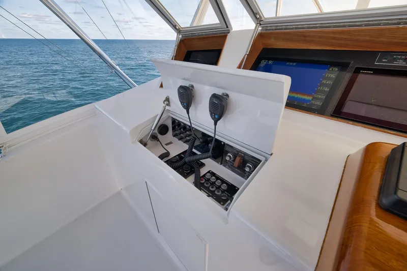 Slide: The Image of Control panel of a 2002 Weaver 60 Convertible yacht with ocean view. - 32