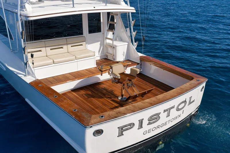 Slide: The Image of Luxury Weaver 60 Convertible yacht, 2002 model, with spacious deck and seating, named "Pistol." - 39
