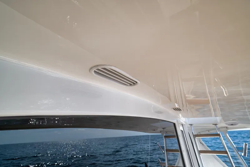 Slide: The Image of Weaver 60 Convertible yacht interior, 2002 model, with ocean view and sleek design. - 44