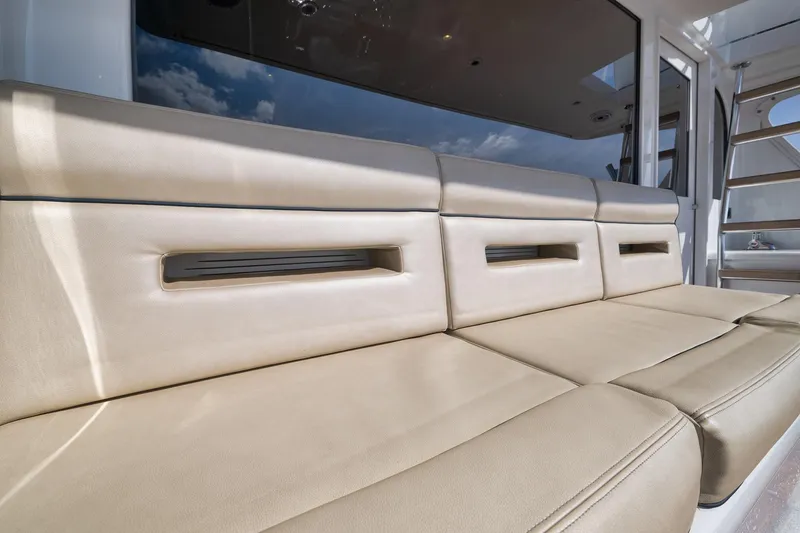 Slide: The Image of Luxurious beige seating on 2002 Weaver 60 Convertible yacht, showcasing modern design and comfort. - 45