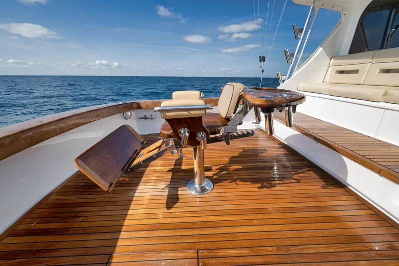 Slide: The Image of Luxurious Weaver 60 Convertible yacht deck with polished wood finish, 2002 model. - 46