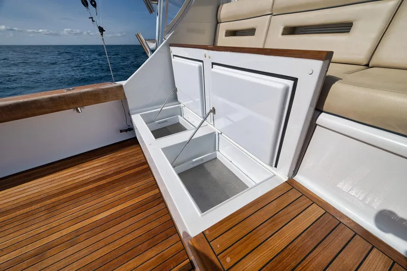 Slide: The Image of Luxury Weaver 60 Convertible yacht deck with open storage compartments, 2002 model. - 57