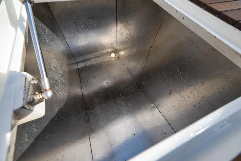 Slide: The Image of Stainless steel compartment in 2002 Weaver 60 Convertible boat, open lid view. - 59