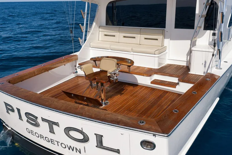 Slide: The Image of Luxury Weaver 60 Convertible yacht deck, 2002 model, with wooden flooring and seating. - 6