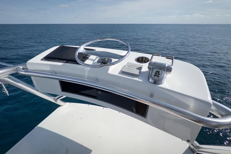 Slide: The Image of Helm of 2002 Weaver 60 Convertible yacht with ocean view. - 65