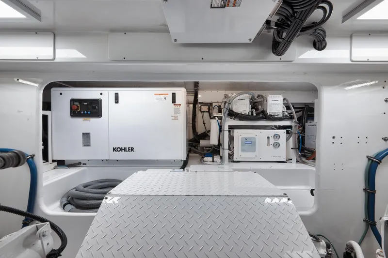 Slide: The Image of Engine room of 2002 Weaver 60 Convertible with Kohler generator and equipment. - 71