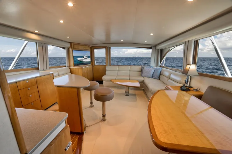 Slide: The Image of Luxurious interior of 2002 Weaver 60 Convertible yacht with ocean view and elegant furnishings. - 9