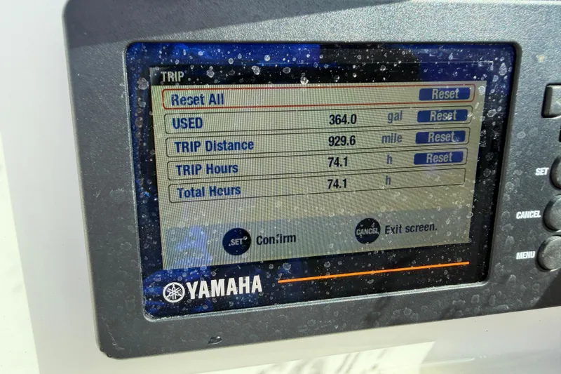 Slide: The Image of Yamaha display on 2019 NauticStar 2302 Legacy, showing trip data and fuel usage. - 13