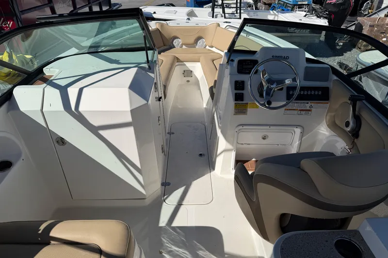 Slide: The Image of 2019 NauticStar 2302 Legacy Dual Console interior with steering wheel and seating. - 16