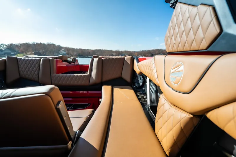 Slide: The Image of Luxurious interior of 2026 Tigé Z3 boat with tan leather seating and scenic lake view. - 14