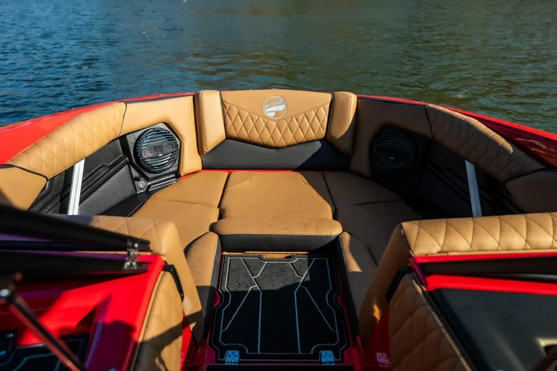 Slide: The Image of Luxurious interior of 2026 Tigé Z3 boat with tan leather seating and water backdrop. - 16