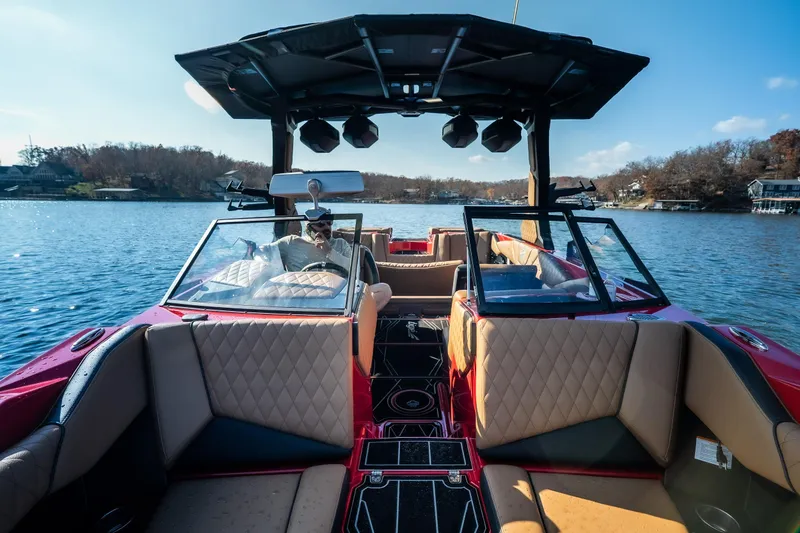 Slide: The Image of 2026 Tigé Z3 boat interior with luxurious seating on a serene lake. - 18