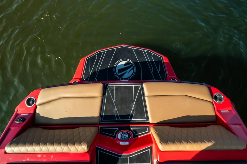 Slide: The Image of 2026 Tigé Z3 boat with red and tan seating, viewed from above on water. - 23
