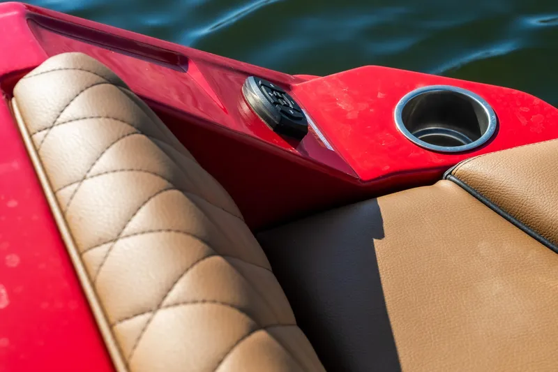 Slide: The Image of 2026 Tigé Z3 boat interior with tan quilted seats and red accents. - 25