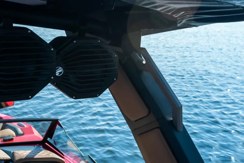 Slide: The Image of 2026 Tigé Z3 boat with speakers, overlooking a serene blue lake. - 29