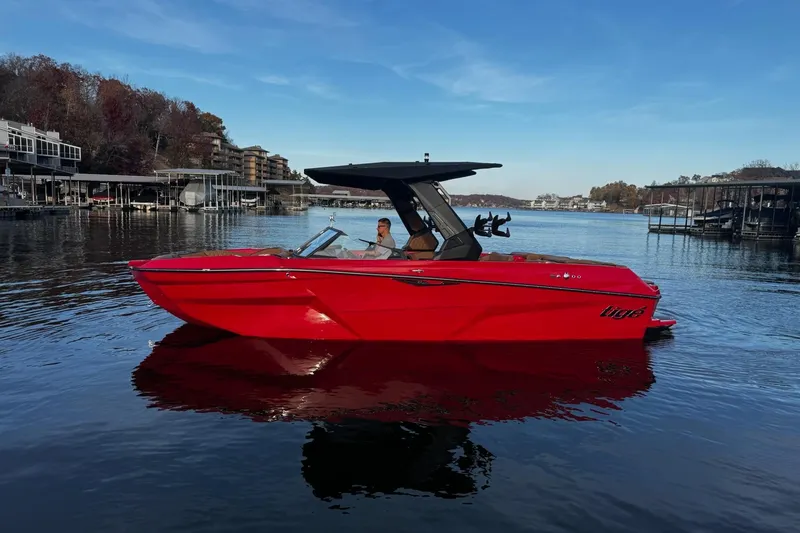 Slide: The Image of 2026 Tigé Z3 boat cruising on water, creating dynamic wake patterns. - 3