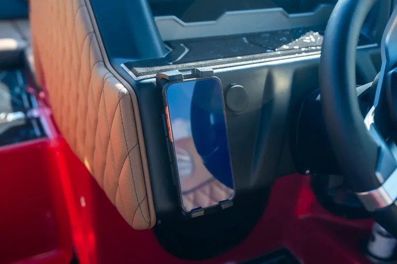 Slide: The Image of 2026 Tigé Z3 boat dashboard with phone holder and quilted leather trim. - 32