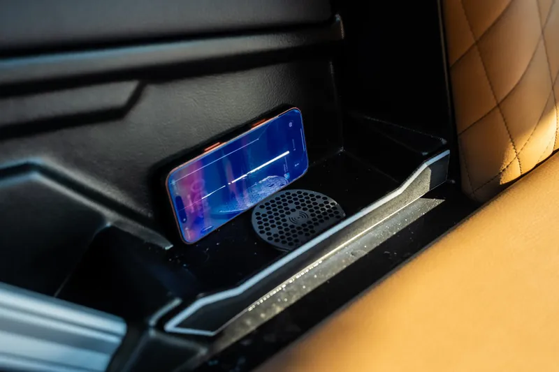 Slide: The Image of 2026 Tigé Z3 interior with smartphone and wireless charging pad. - 34