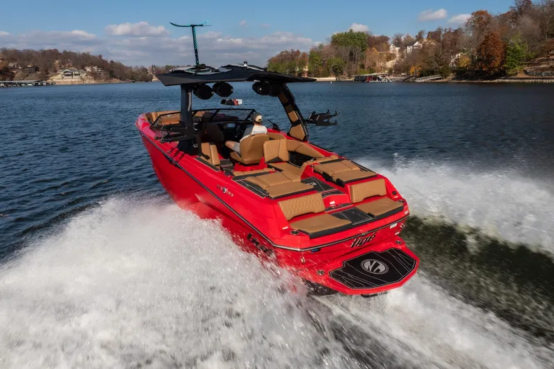 Slide: The Image of 2026 Tigé Z3 boat cruising on a lake, showcasing sleek red design and powerful wake. - 5