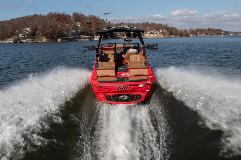 Slide: The Image of 2026 Tigé Z3 boat cruising on a lake, creating a dynamic wake. - 6