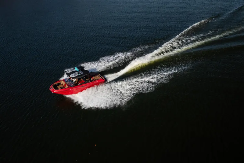 Slide: The Image of 2026 Tigé Z3 boat cruising on open water, leaving a dynamic wake. - 7