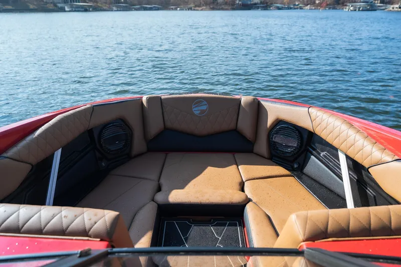 Slide: The Image of Luxurious interior of 2026 Tigé Z3 boat with tan seating on a lake. - 8