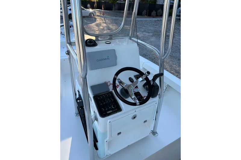 Slide: The Image of 2016 Pathfinder 2200 TRS boat with Yamaha 200 outboard motor, parked outdoors. - 4