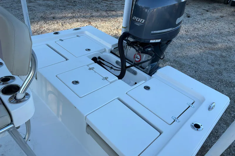 Slide: The Image of 2016 Pathfinder 2200 TRS boat console with steering wheel and Garmin display. - 5