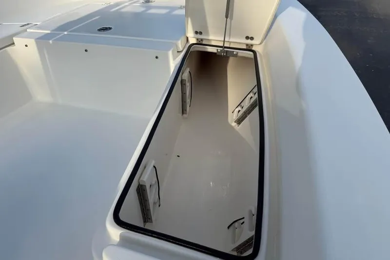 Slide: The Image of Open storage compartment on a 2016 Pathfinder 2200 TRS boat. - 7