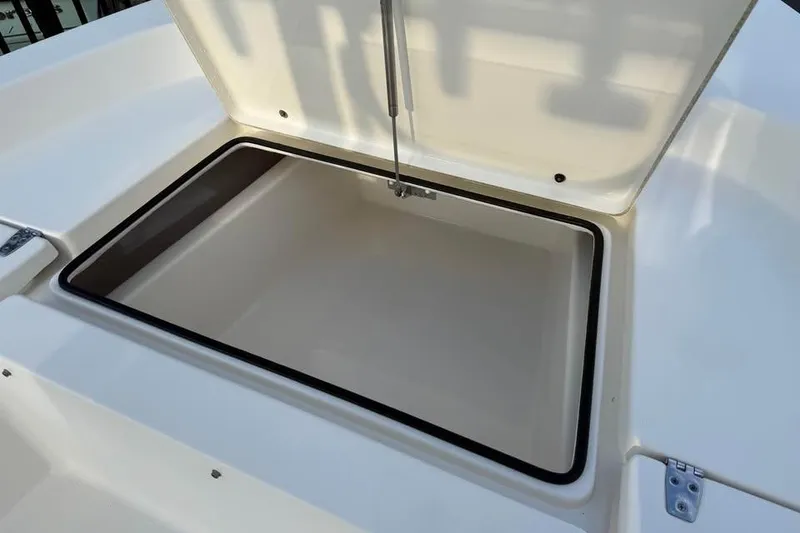 Slide: The Image of Open storage compartment on 2016 Pathfinder 2200 TRS boat, showcasing interior space. - 8