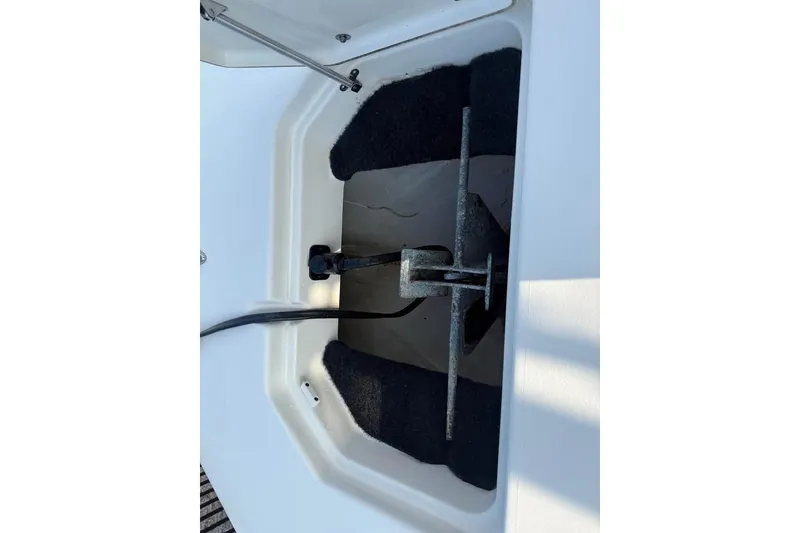 Slide: The Image of Anchor compartment of 2016 Pathfinder 2200 TRS boat, featuring secure storage. - 9