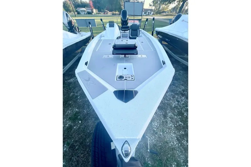 Slide: The Image of 2026 Xpress H20C Crappie boat, sleek design, parked outdoors, ready for fishing adventures. - 5