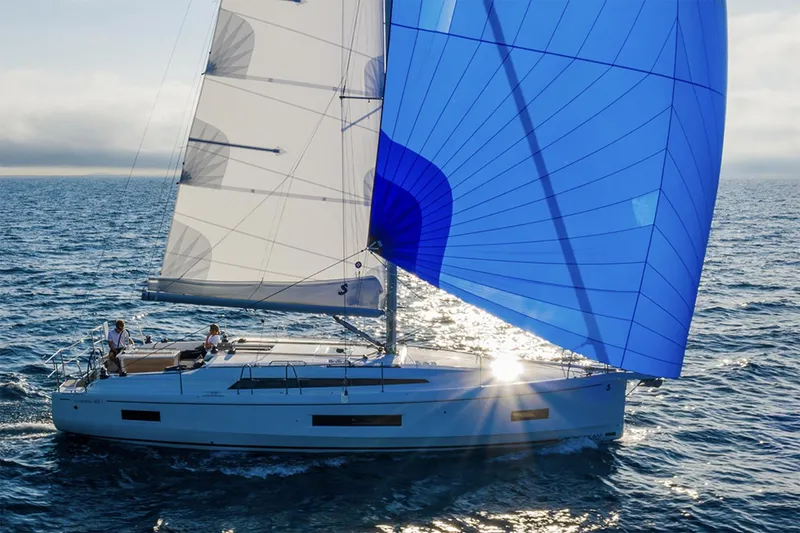 Slide: The Image of Manufacturer Provided Image: 2026 Beneteau Oceanis 40.1 sailing with blue spinnaker on open sea. - 2