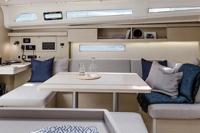 Slide: The Image of Manufacturer Provided Image: Interior of 2026 Beneteau Oceanis 40.1 yacht, featuring modern seating and dining area. - 6