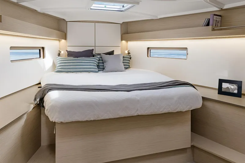 Slide: The Image of Manufacturer Provided Image: Luxurious cabin interior of 2026 Beneteau Oceanis 40.1 yacht with cozy bedding. - 8