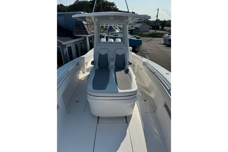 Slide: The Image of 2024 Invincible 36 Open Fisherman boat with cushioned seating and sleek design. - 11