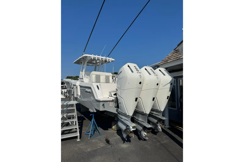 Slide: The Image of 2024 Invincible 36 Open Fisherman boat with triple outboard engines. - 2