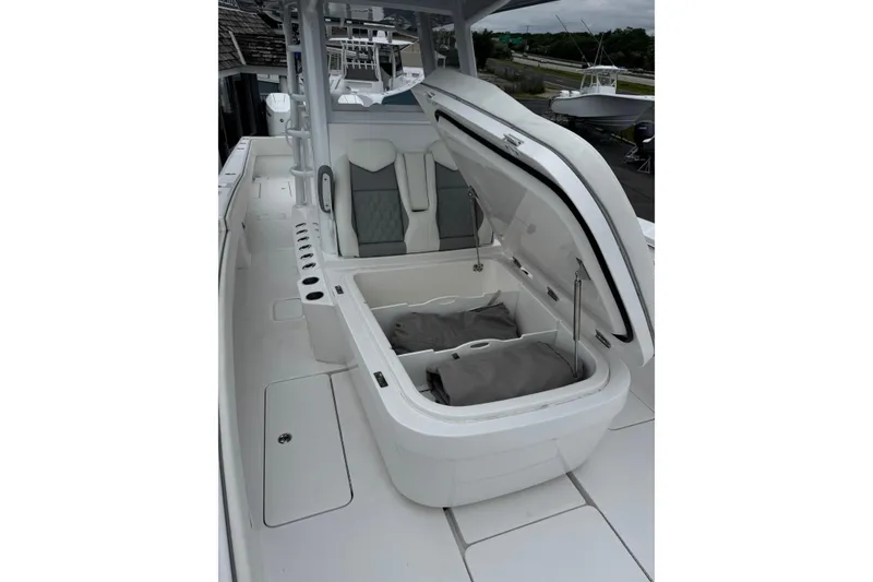 Slide: The Image of 2024 Invincible 36 Open Fisherman boat interior with open storage compartment. - 5