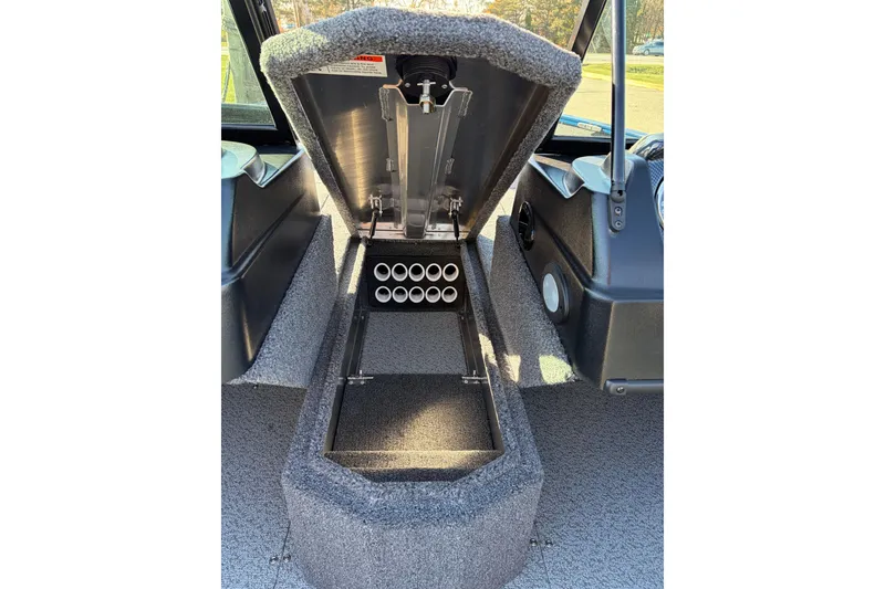 Slide: The Image of 2026 Lowe Fishing Machine 1775WT interior storage compartment with rod holders. - 13