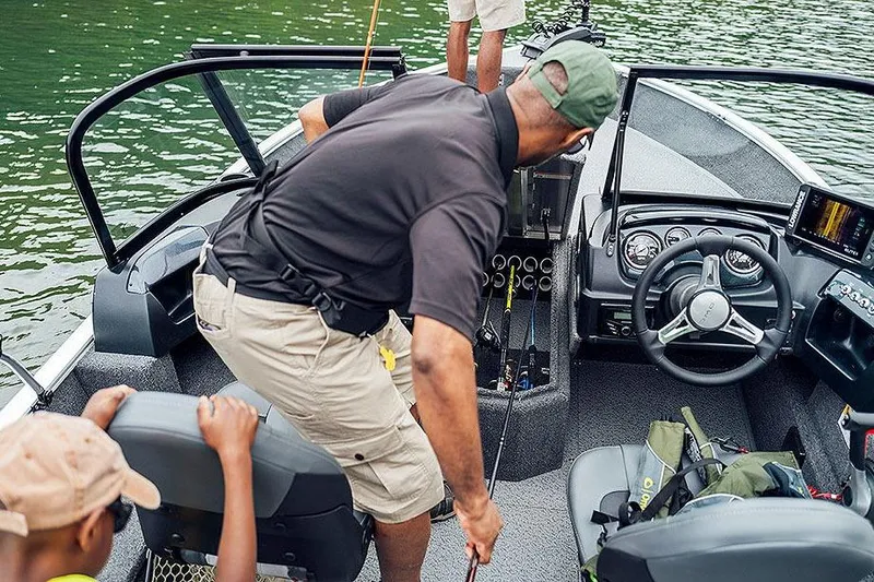 Slide: The Image of Manufacturer Provided Image: 2026 Lowe Fishing Machine 1775WT interior with people fishing on a lake. - 14