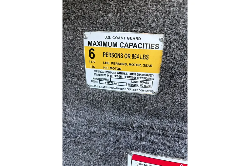 Slide: The Image of 2026 Lowe Fishing Machine 1775WT capacity plate, 6 persons or 854 lbs, U.S. Coast Guard compliant. - 17