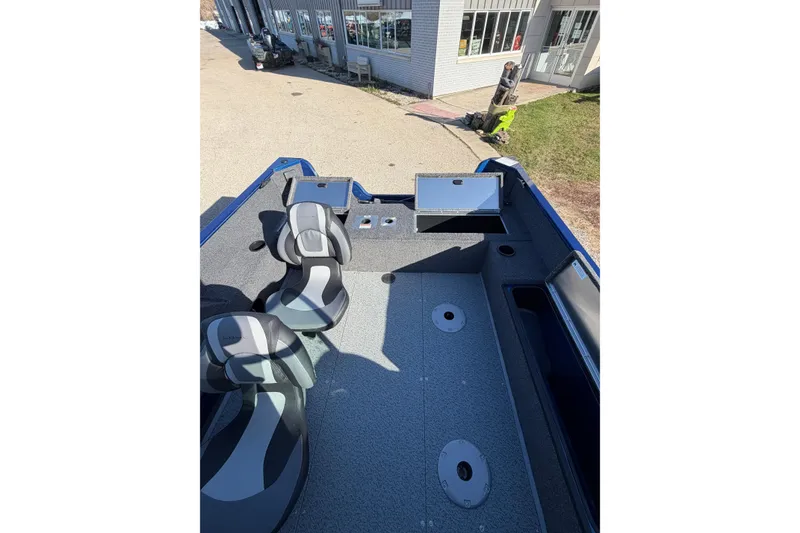 Slide: The Image of 2026 Lowe Fishing Machine 1775WT interior with seating and storage compartments. - 5