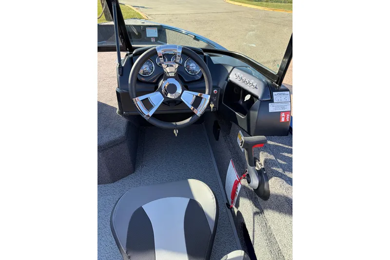 Slide: The Image of 2026 Lowe Fishing Machine 1775WT dashboard with steering wheel and controls. - 6