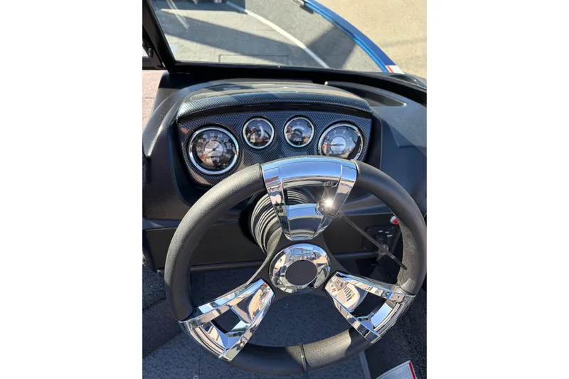 Slide: The Image of Steering wheel and dashboard of 2026 Lowe Fishing Machine 1775WT boat. - 7
