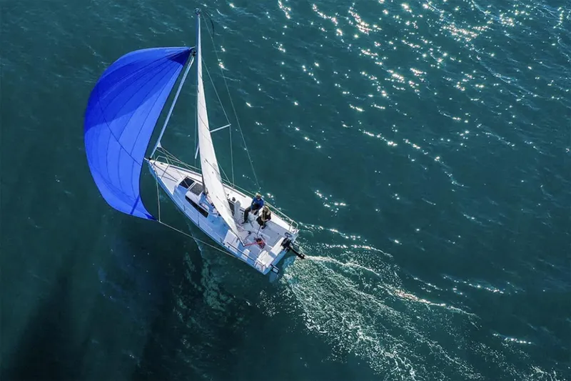 Slide: The Image of Manufacturer Provided Image: Sailing yacht Beneteau First 24 (2026) with blue spinnaker on open water. - 2