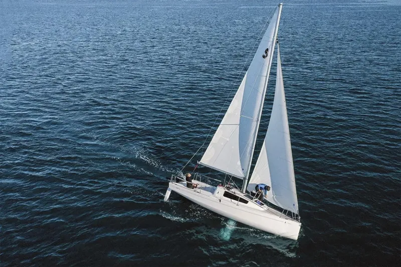 Slide: The Image of Manufacturer Provided Image: 2026 Beneteau First 24 sailboat navigating open waters with full sails. - 3