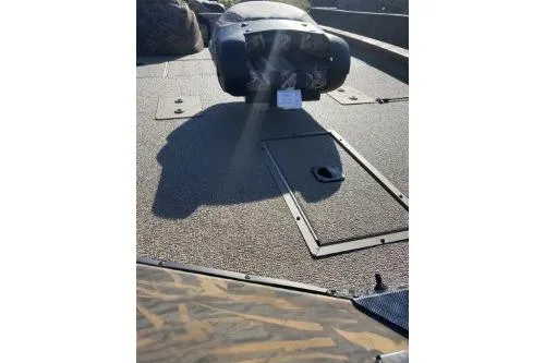 Slide: The Image of 2026 G3 Sportsman 1810 PFX Camo boat deck with storage compartments. - 5