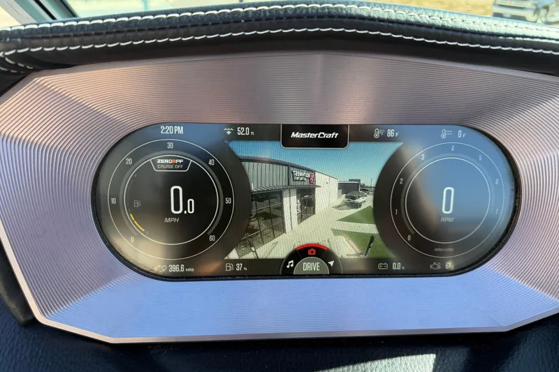 Slide: The Image of Dashboard of 2022 MasterCraft XT24 boat displaying speed, RPM, and camera view. - 7